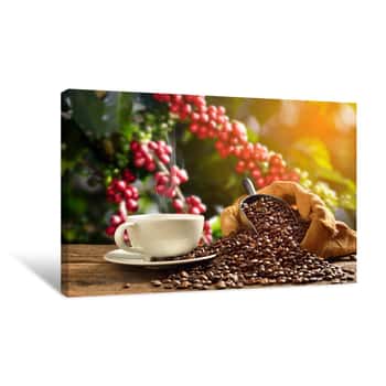 Image of Cup Of Coffee With Smoke And Coffee Beans In Burlap Sack On Coffee Table Canvas Print