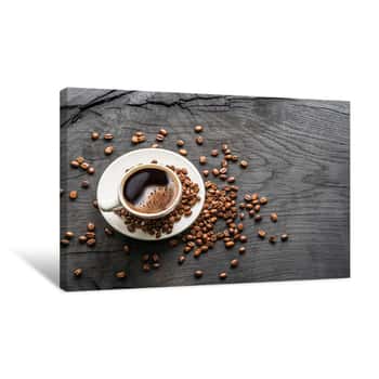 Image of Cup Of Coffee Surrounded By Coffee Beans  Top View Canvas Print