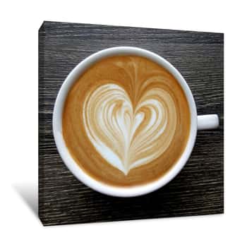 Image of Top View Of A Mug Of Latte Art Coffee On Timber Background Canvas Print