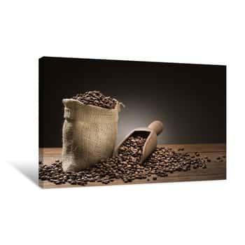Image of Bunch Of Coffee Beans With Burlap Sack And Wooden Scoop On Table Canvas Print