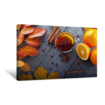 Image of Hot Tea With Spices And Orange Amid Autumn Leaves Canvas Print