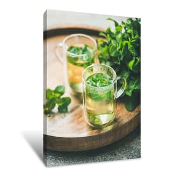 Image of Hot Herbal Mint Tea Drink In Glass Mugs Over Wooden Tray With Fresh Garden Mint Leaves, Selective Focus, Close-up Canvas Print