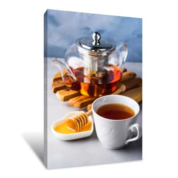 Image of Cup Of Red Tea Rooibos And Honey With Glass Teapot On Blue Canvas Print