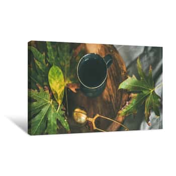 Image of Fall Morning Tea In Bed  Black Mug Of Tea With Sieve And Colorful Fallen Leaves On Rustic Wooden Tray Over Bed Linen And Blanket Background, Selective Focus  Autumn Mood Concept Canvas Print