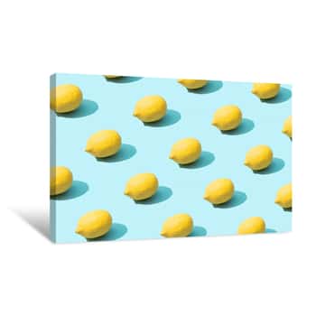 Image of Trendy Sunlight Summer Pattern Made With Yellow Lemon On Bright Light Blue Background  Minimal Summer Concept Canvas Print