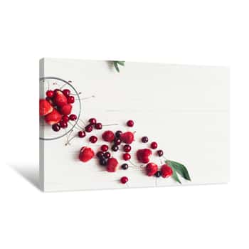 Image of Fresh Cherries And Strawberries Scattered From Bowl On White Rustic Wooden Background  Ripe Juicy Red  Berries On Table, Harvest Concept  Space For Text  Modern  Summer Flat Lay Canvas Print