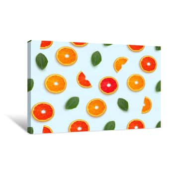 Image of Pattern Half Cut With Orange Fruits And Grapefruit With Leaf Petals On White Background Canvas Print