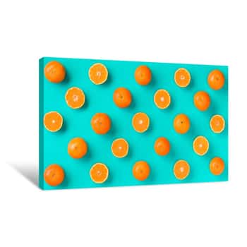 Image of Fruit Pattern Of Fresh Mandarin Slices Over Blue Background  Flat Lay, Top View  Pop Art Design, Creative Summer Concept  Half Of Citrus In Minimal Style  Tangerine Canvas Print