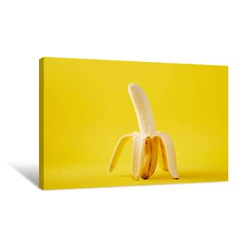 Image of Close Up View Of Ripe Banana Isolated On Yellow Canvas Print