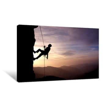 Image of Silhouette Of Rock Climber At Sunset Canvas Print