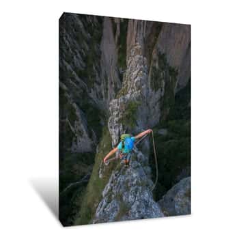 Image of Female Rock Climber Standing On Top Of Mountain Gorges Canvas Print