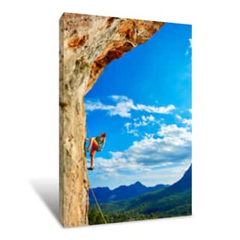 Image of Rock Climber Climbing Up A Cliff Canvas Print