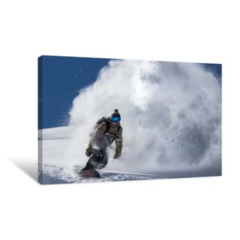 Image of Male Snowboarder Curved And Brakes Spraying Loose Deep Snow On The Freeride Slope Canvas Print