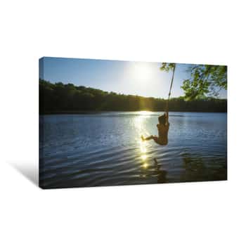 Image of Boy Bungee Jumping Over Water  Kid Swings On A Rope And Ready To Jump Into The Water  Back View  The Concept Of Healthy Lifestyle Canvas Print