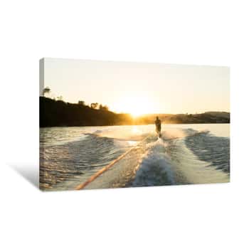 Image of A Water Skier Takes A Run At Sunset On A Empty Glassy Lake Canvas Print
