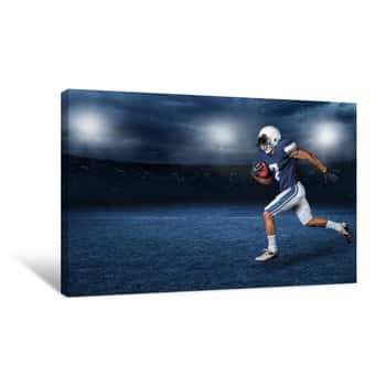 Image of American Football Player Running For A Touchdown In A Large Outdoor Professional Football Stadium At Night Canvas Print
