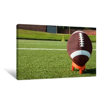 Image of Closeup Of American Football On Tee On Field Canvas Print