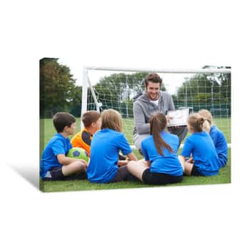 Image of Coach Giving Team Talk To Elementary School Soccer Team Canvas Print
