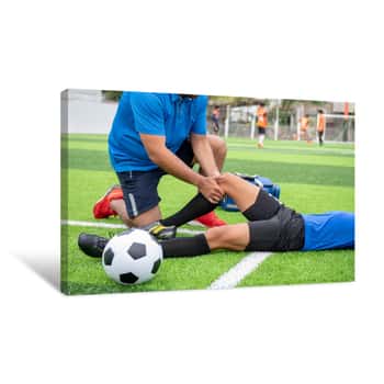 Image of Footballer Wearing A Blue Shirt, Black Pants Injured In The Lawn During The Race Canvas Print