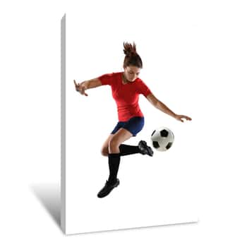Image of Female Soccer Player Kicking Ball Canvas Print