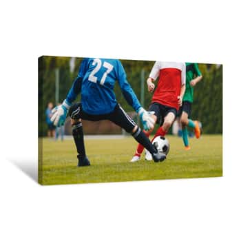 Image of Football Action  Boys Kicking Football Match On Field  Children Soccer Game At School Pitch  Kids Playing Sports Outdoor  Youth Football Game Canvas Print