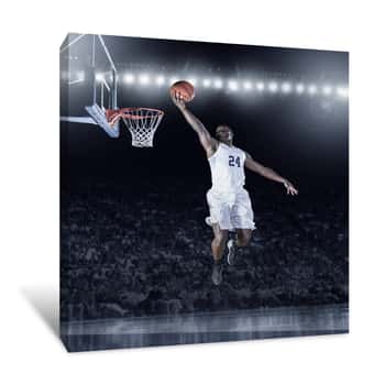 Image of Athletic African American Basketball Player Scoring A Layup Basket During A Professional Basketball Game In A Crowded Arena Canvas Print