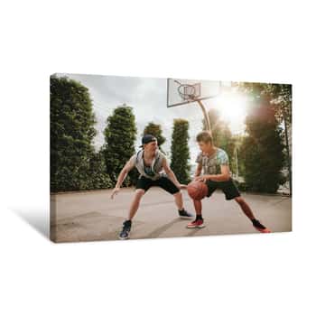 Image of Two Young Men Having A Game Of Basketball Canvas Print