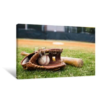 Image of Old Baseball, Glove, And Bat On Field Canvas Print