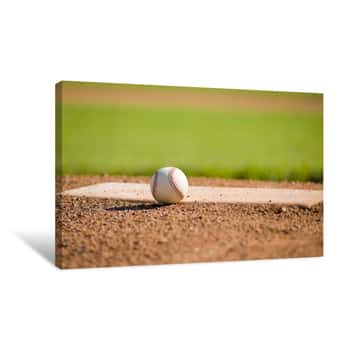 Image of A White Leather Baseball Lying On Top Of The Pitcher\'s Mound Canvas Print