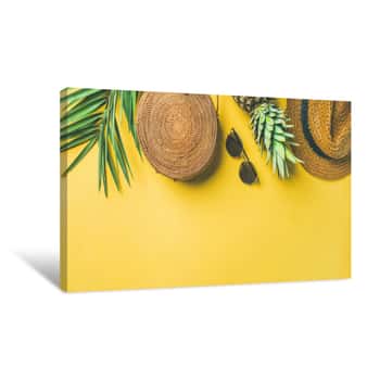 Image of Colorful Summer Female Fashion Outfit Flat-lay  Straw Hat, Bamboo Bag, Sunglasses, Palm Branches, Pineapple Over Yellow Background, Top View, Copy Space, Wide Composition  Summer Fashion, Holiday Canvas Print