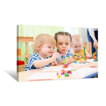 Image of Happy Kids Doing Arts And Crafts In Day Care Centre Canvas Print