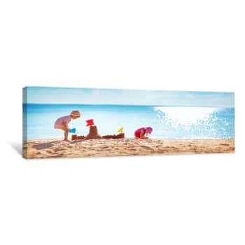 Image of Boy And Girl Playing On The Beach Canvas Print