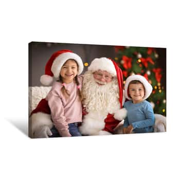 Image of Little Children Sitting On Authentic Santa Claus\' Knees Indoors Canvas Print