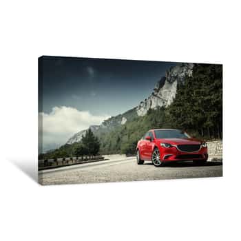 Image of Red Car Standing On The Road Near Mountains At Daytime Canvas Print