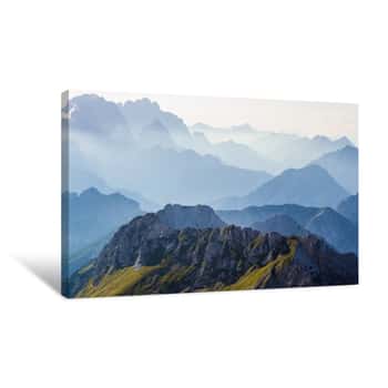 Image of Layers Of Silhouettes Of Mountain Ridges And Peaks In The Italian Alps, At Sunset  View From The Route Down From Mangart (Mangrt) Peak, Julian Alps, Triglav, Slovenia Canvas Print