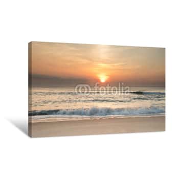 Image of The Sun Rising Over The Ocean At Sunrise With Waves Crashing Ashore Canvas Print