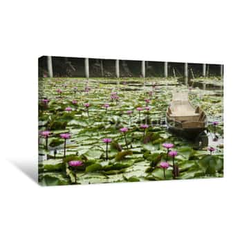 Image of Wooden Boat Floating For Travelers People Rowing With Red Lotus Or Pink Water Lily In Pond At Garden Canvas Print