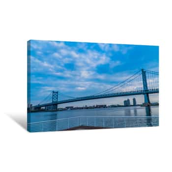 Image of SUSPENSION BRIDGE OVER RIVER AGAINST CLOUDY SKY Canvas Print