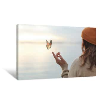 Image of Colorful Butterfly Is Laying On A Woman\'s Hand Canvas Print