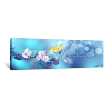 Image of Beautiful Blue Yellow Butterfly In Flight And Branch Of Flowering Apricot Tree In Spring At Sunrise On Light Blue And Violet Background Macro  Elegant Artistic Image Nature  Banner Format, Copy Space Canvas Print