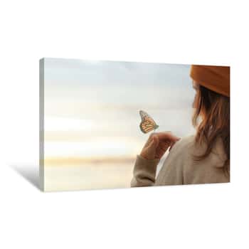 Image of Colorful Butterfly Is Laying On A Woman\'s Hand Canvas Print