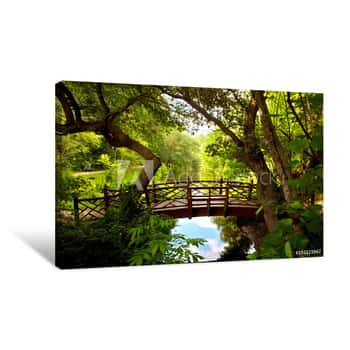 Image of A Romantic Colonial Bridge  In Williamsburg Virginia Immersed In A Green Woodland With A Beautiful Reflecting Water Pond Canvas Print