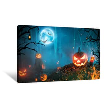 Image of Spooky Halloween Pumpkins In Dark Forest Canvas Print