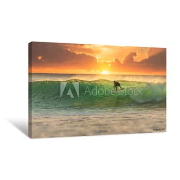 Image of Surfer Surfing At Sunrise Canvas Print