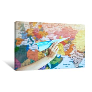 Image of Hand With Paper Origami Airplane On World Map Background Canvas Print