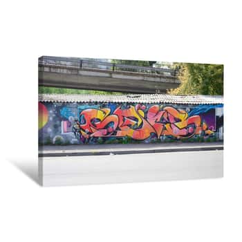 Image of Fragment Of Graffiti Drawings  The Old Wall Decorated With Paint Stains In The Style Of Street Art Culture  Colored Background Texture In Warm Tones Canvas Print