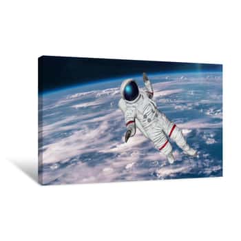 Image of The Astronaut Hits Planet Earth  Elements Of This Video Furnished By Nasa  3D Rendering Canvas Print