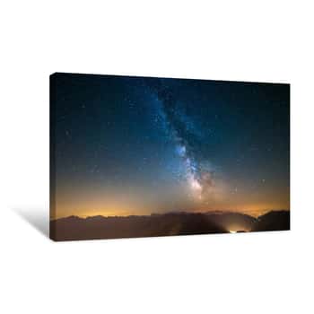 Image of Milky Way And Starry Sky Captured At High Altitude In Summertime On The Alps With Glowing Aosta Valley Below, Travel Destination In Italy Canvas Print