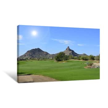 Image of Sun Shining Over A Green Golf Fairway With Mountains And A Blue Sky Canvas Print
