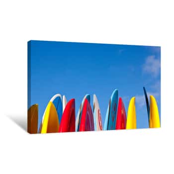 Image of Stack Of Surfboards With Sand On Surface Canvas Print